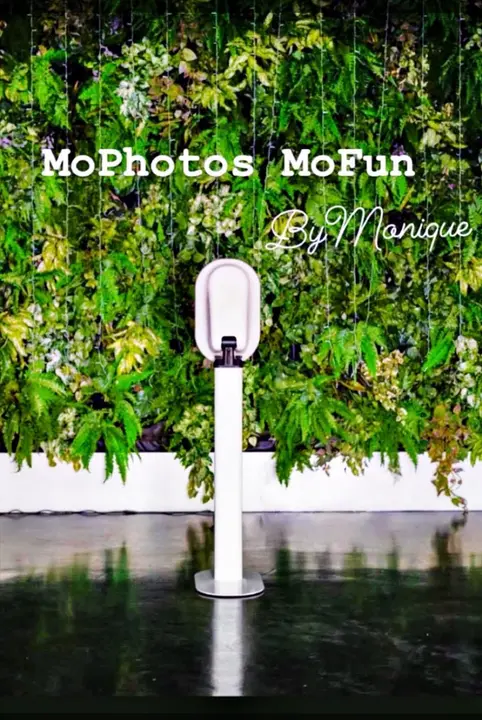 The booth in front of a greenery wall