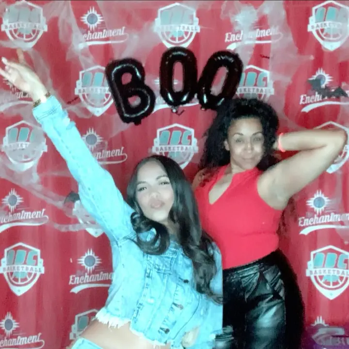 Two friends striking a playful pose