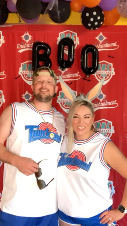 A couple in matching Tune Squad jerseys and bunny ears